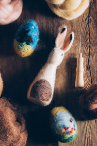 High angle view of multi colored eggs on table