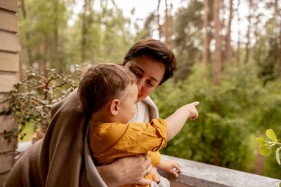 Happy grandmother and grandson enjoy time together. positive middle age woman