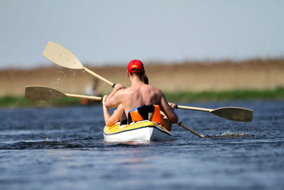 People paddling in kayak