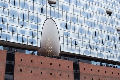 Low angle view of office building against sky