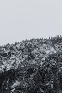 Scenic view of snow covered mountain against clear sky