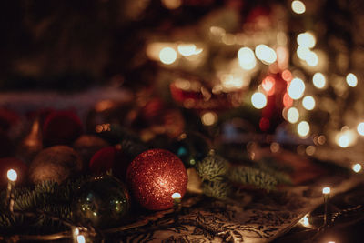 Christmas academia vintage table - fir, candles, wine, red decorations, books, glasses, gingerbread