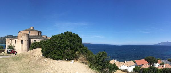 Scenic view of sea against blue sky