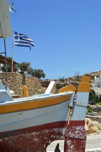 Tilt image of car against blue sky