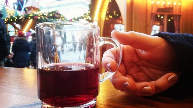 drink, food and drink, refreshment, freshness, indoors, drinking glass, table, alcohol, lifestyles, coffee - drink, person, close-up, leisure activity, holding, glass - material, restaurant, glass