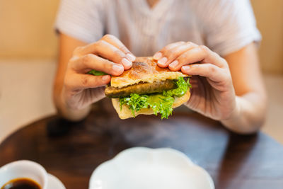 Midsection of man holding food