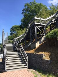 Stairs leading to built structure against clear sky