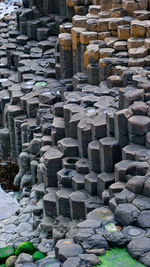 Stack of stones against stone wall