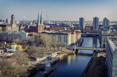 High angle view of river amidst buildings in city