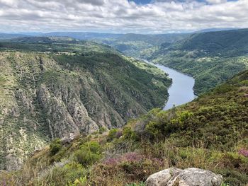 High angle view of river amidst landscape against sky