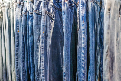 Full frame shot of jeans hanging at store