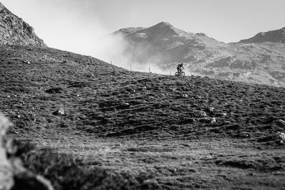 Rear view of hiker on mountain