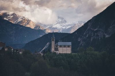 Church against mountains and clouds