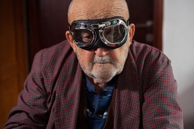 Portrait of senior man wearing goggles