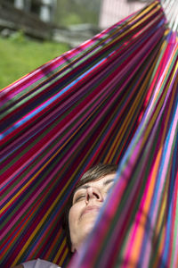 Woman relaxing in hammock