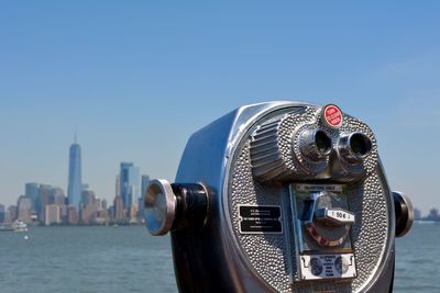 Close-up of binocular against clear sky