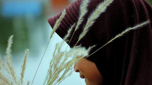 Close-up of girl with plants