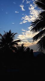 Low angle view of silhouette palm trees against sky at sunset