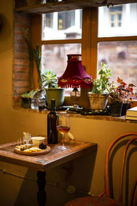 Wine bottles on table at home