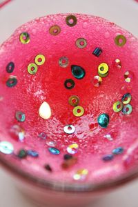 Close up of pink flower in plate on table