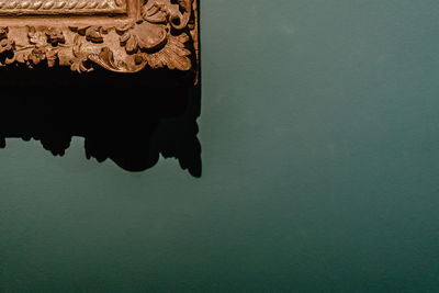 High angle view of reflection on wall by lake