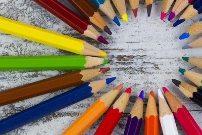 High angle view of multi colored pencils on table
