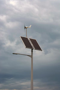 Low angle view of wind turbine against sky