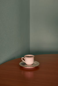 Coffee cup on a corner table. conceptual image