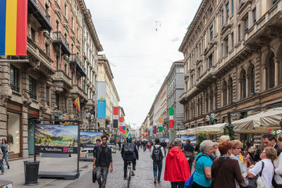 People walking on street in city