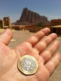 Close-up of human hand holding built structure