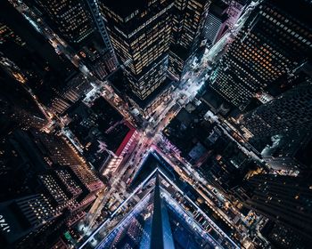 High angle view of city lit up at night