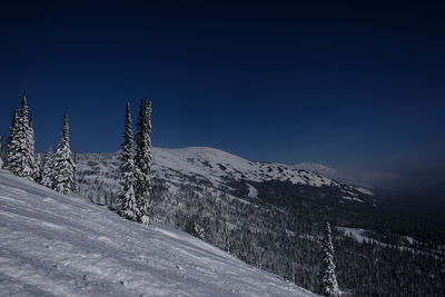 Sunny winter morning in the mountains of sheregesh on the ski track