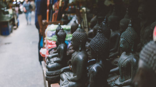 Close-up of statues for sale