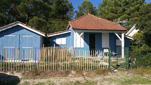 Exterior of old house against blue sky