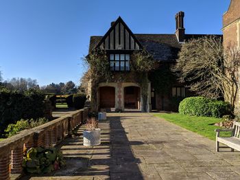 Footpath by historic building against sky