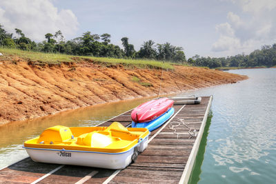 Boats in lake against sky