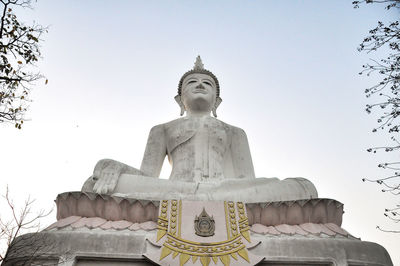 Low angle view of statue against sky