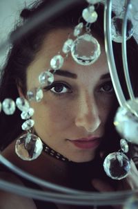 Close-up portrait of woman with crystal decoration