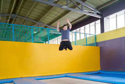 Full length of boy jumping