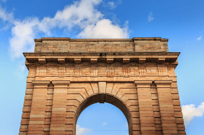 Low angle view of historical building against cloudy sky