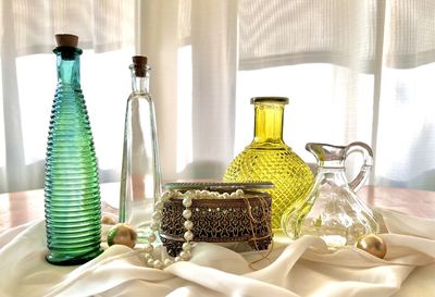 Close-up of wine bottles on table
