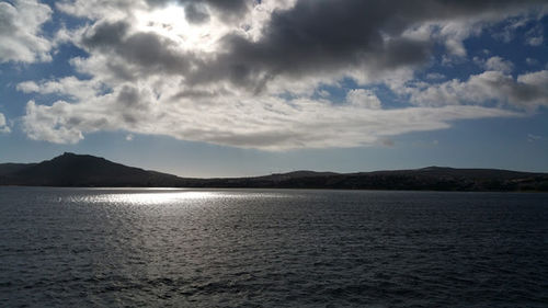 Scenic view of mountains against cloudy sky