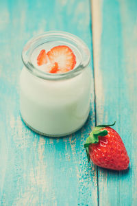 Close-up of strawberries in glass on table