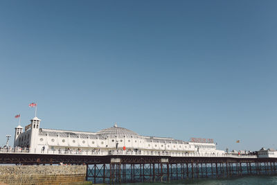 Palace pier over sea against clear sky