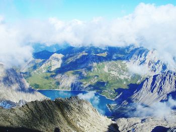 Scenic view of mountains against cloudy sky