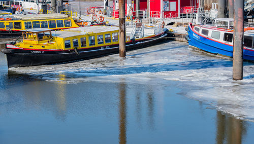 Boats moored on sea