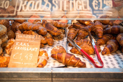 Close-up of croissants for sale in bakery shop