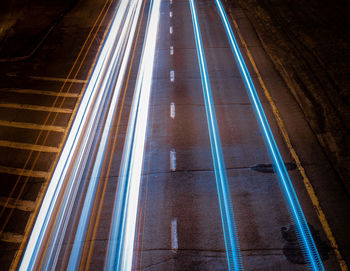 High angle view of light trails on road in city