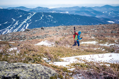 Full length of person on snowcapped mountains during winter