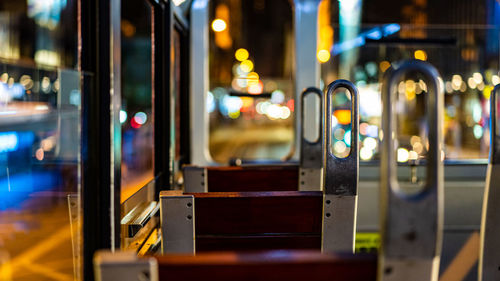 Illuminated train in city at night